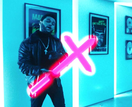 The Weeknd holding a cross in his Starboy Video