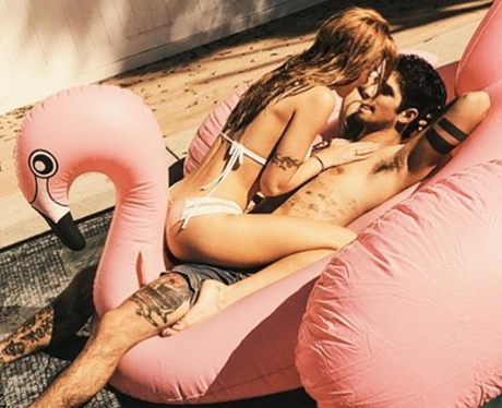 Bella Thorne and Tyler Posey pose in the pool