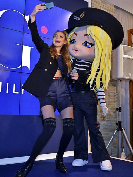 Gigi Hadid poses with cartoon version of herself