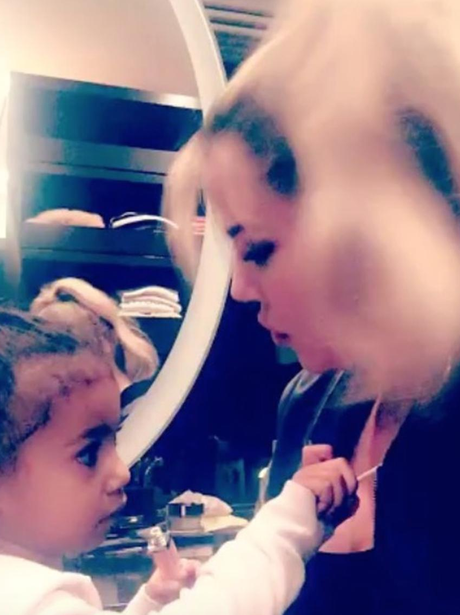 North West does Khloe Kardashian's make up