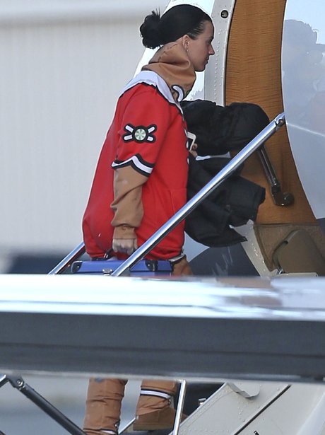 Katy Perry boards private jet alongside Orlando Bl