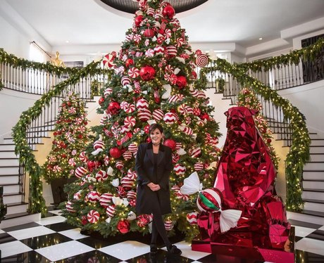 Kris Jenner poses infront of her massive Christmas