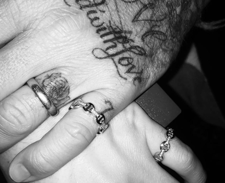 David Beckham and Brooklyn show off matching rings