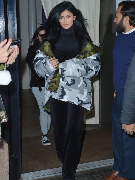Kylie Jenner tries to blend in in camouflage jacke