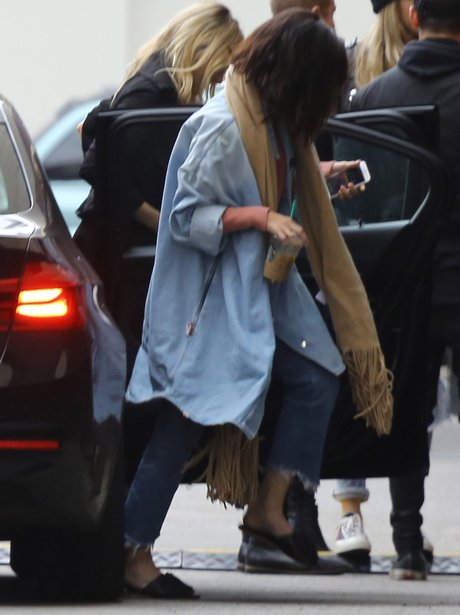 Selena Gomez listening to The Weeknd