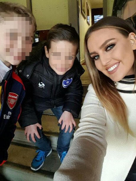 Perrie Edwards and fans at an Arsenal game