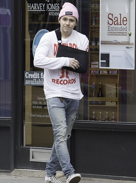 Brooklyn Beckham with arm cast