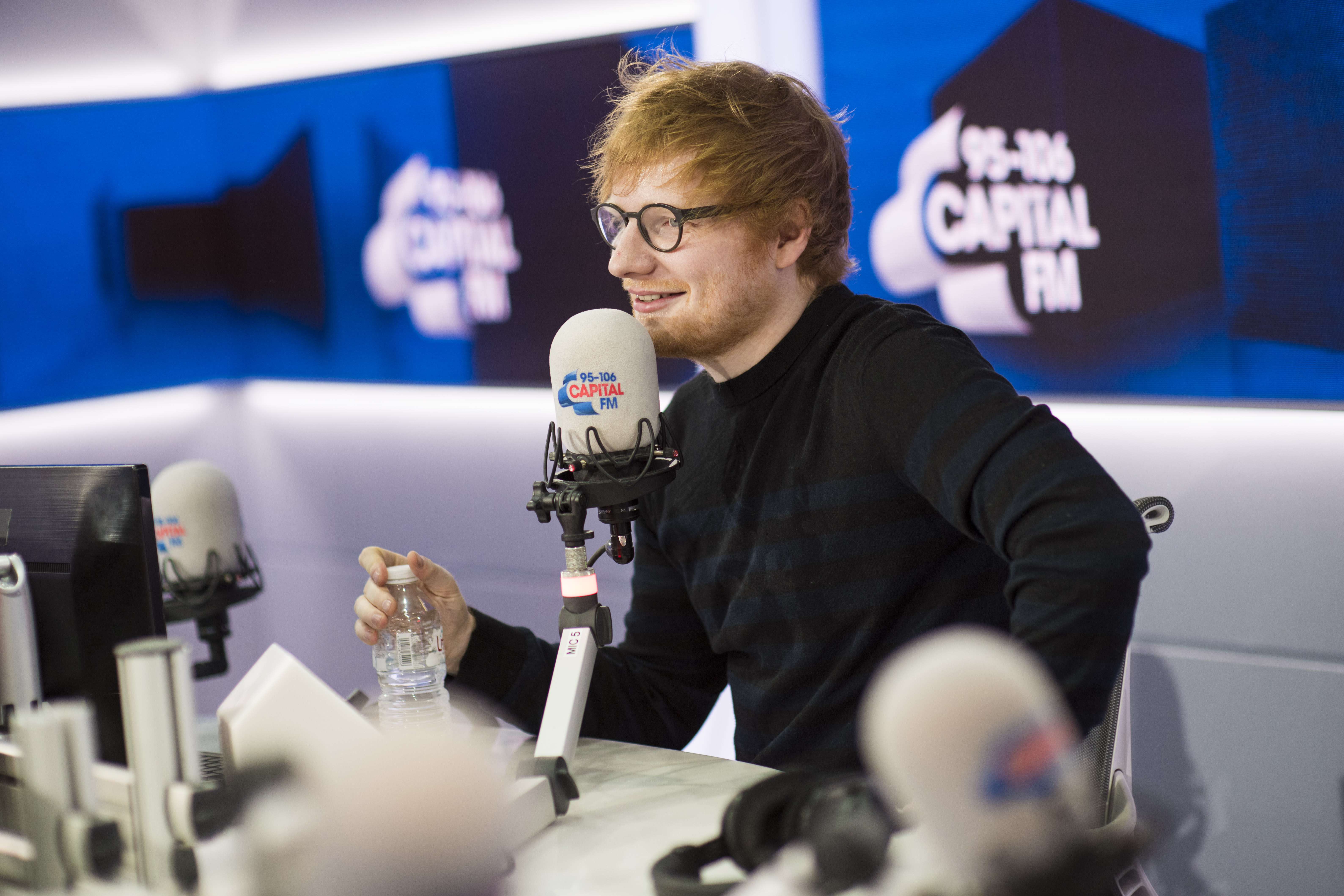 Ed Sheeran tattoos Roman Kemp live on air