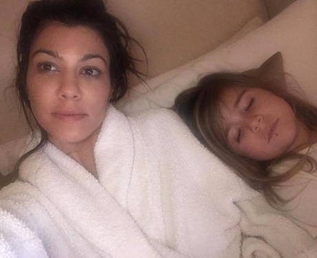 Kourtney Kardashian watches the Oscars from bed as