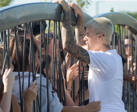 Justin Bieber greets his fans outside his hotel