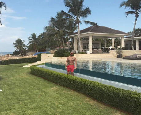 Drake poses at his impressive mansion