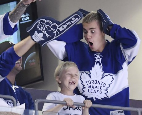 Justin Bieber and Jaxon enjoy a hockey match
