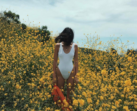 Kendall Jenner poses in a field