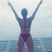 Image 10: Kourtney Kardashian poses on the edge of a boat lo