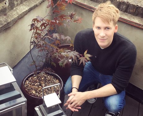 Dustin Lance Black plants tree with Tom Daley to m
