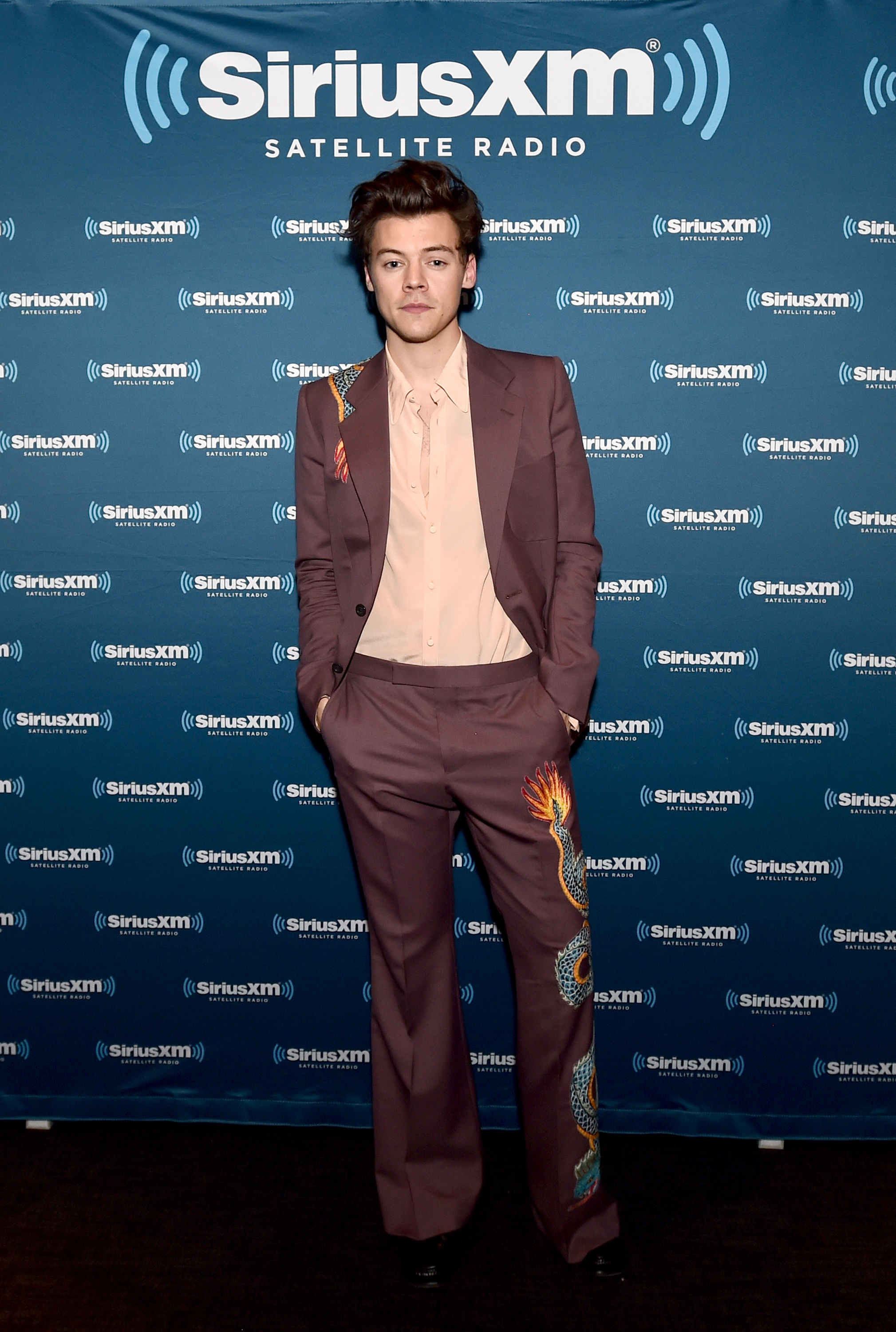 Harry Styles in bold flared trouser suit