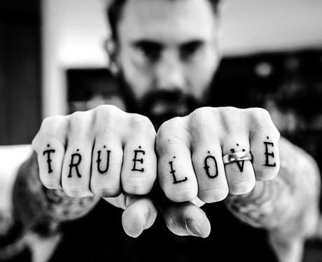 Adam Levine shows off his new tattoo