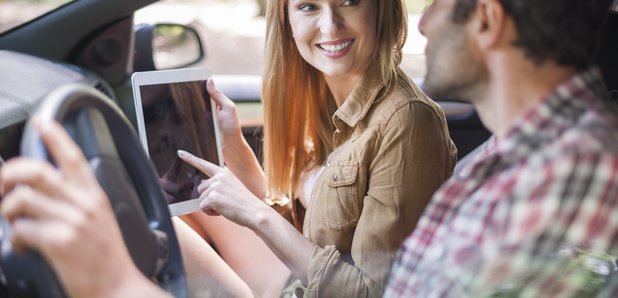Couple In Car With iPad