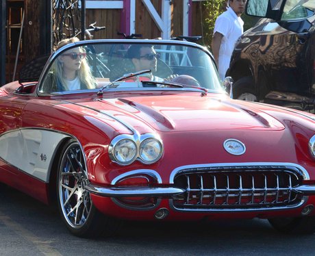 Joe Jonas and Sophie Turner in a red convertible