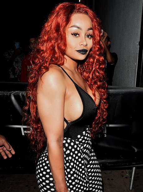 Blac Chyna opts for a red curly wig