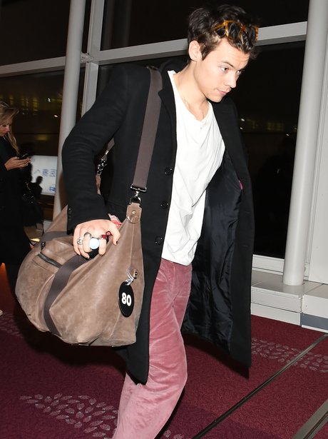 Only Harry Styles can pull off bright pink flared trousers - This Week ...