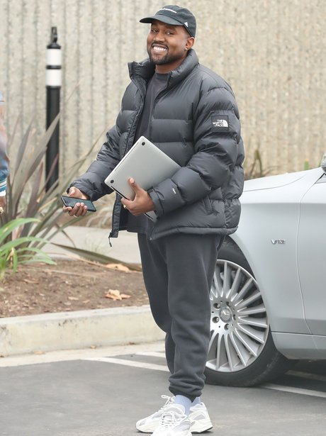 Kanye West beaming
