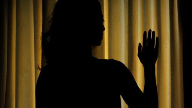 woman silhouette abuse slavery