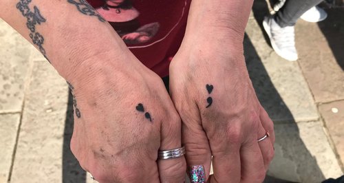 Semi Colon tattoos on a woman's hands from Lancash