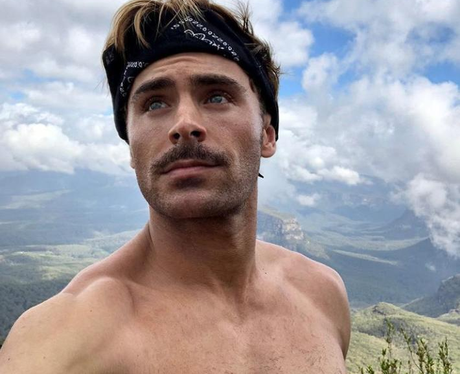 Zac Efron with a mountain on top of a mountain topless - Zac Efron's Hair...  - Capital